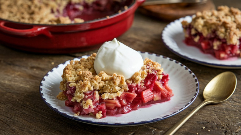 fruit crumble topped with a crispy topping and dollop of whipped cream