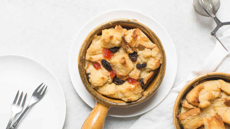 bread pudding in a ceramic skillet sitting on a white countertop