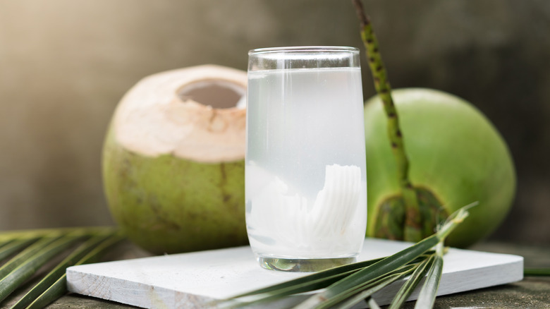 Coconuts with glass of coconut water