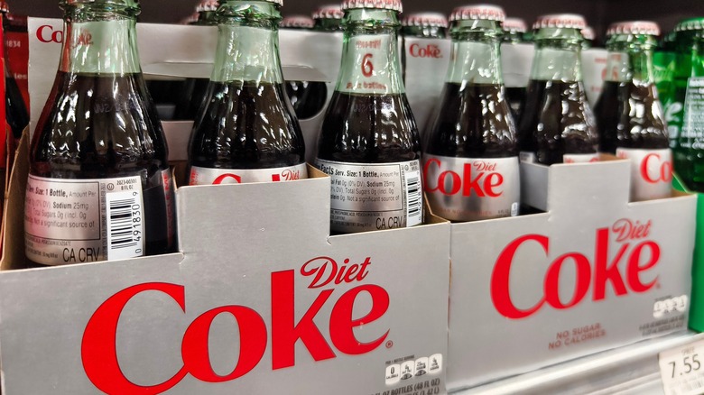 Bottles of Diet Coke on store shelf
