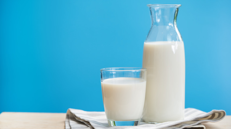 Glass and carafe of milk
