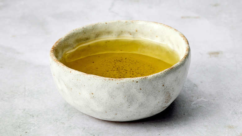 A serving of oil in a cup