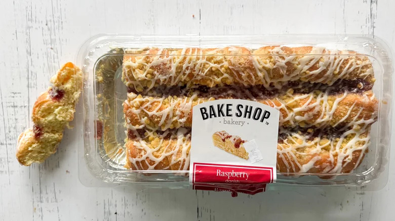 Raspberry danish pastry on white background