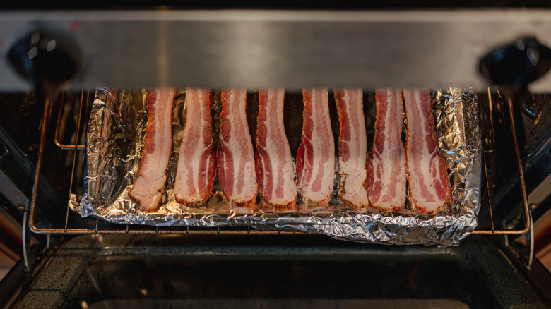 strips of raw bacon on foil-lined cookie sheet