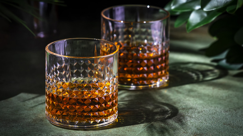 Two glasses of Scotch whisky on a table