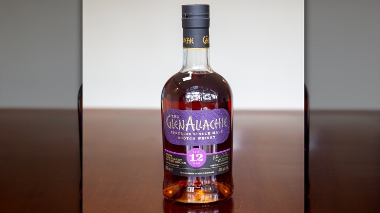 A person pouring a dram of GlenAllachie Speyside Single Malt 12 Years Old