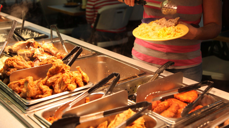 Person serving themselves at Casey's Buffet