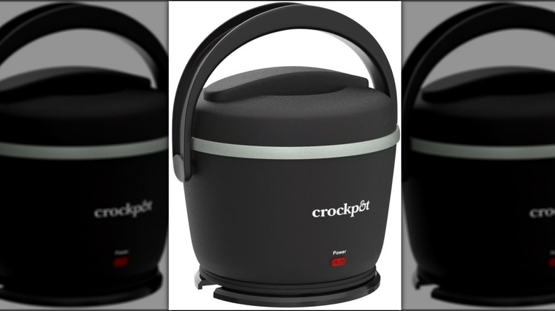 Small black portable slow cooker against a white background