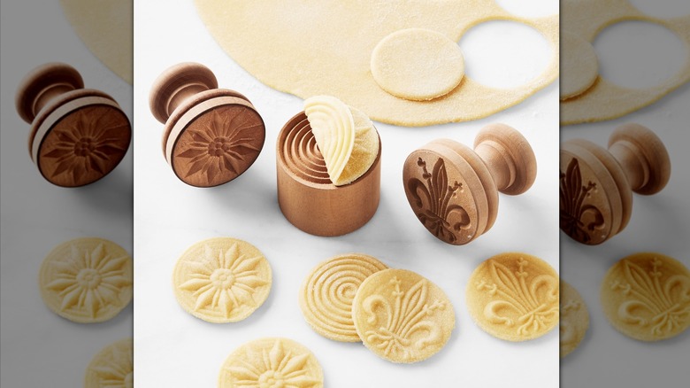 Pasta stamps and pasta medallions embossed with their designs.