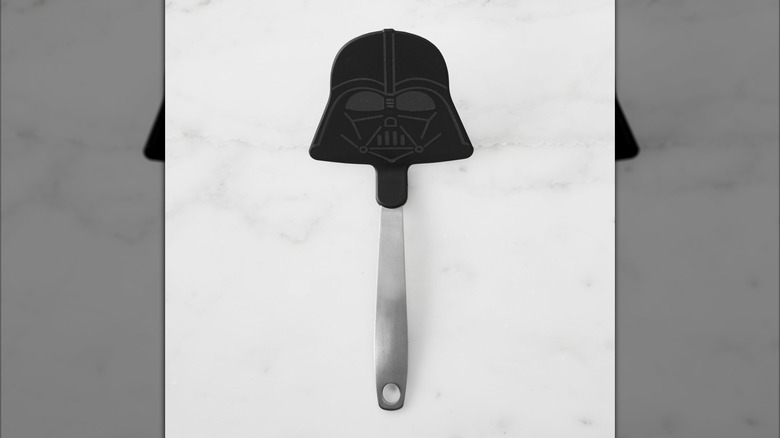 A Darth Vader turner with a silver handle