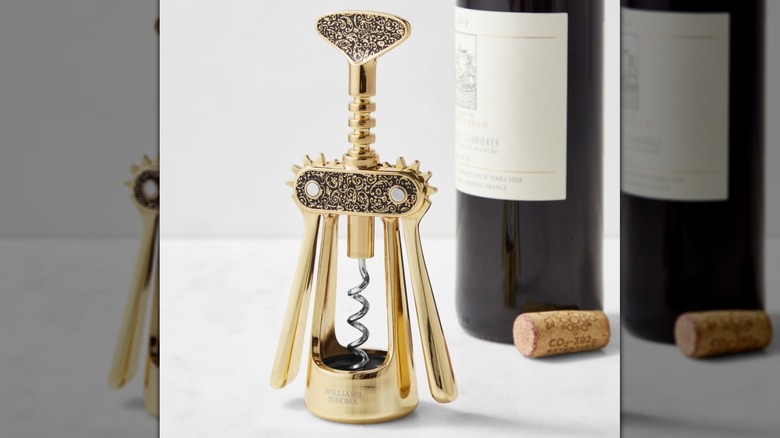 A unique gold corkscrew with intricate details