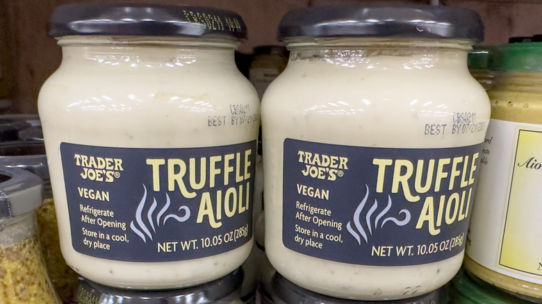 Jars of truffle aioli on grocery store shelf