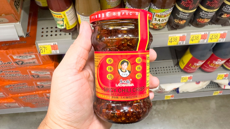 Person holding a jar of chili crisp