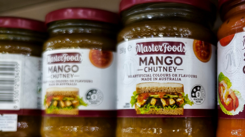 Jars of mango chutney on a supermarket shelf