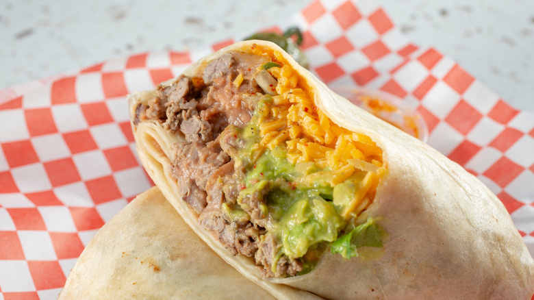 A closeup view of a carne asada burrito