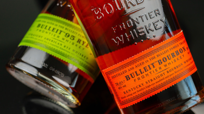 A closeup shot of two bottles of Bulleit whiskey