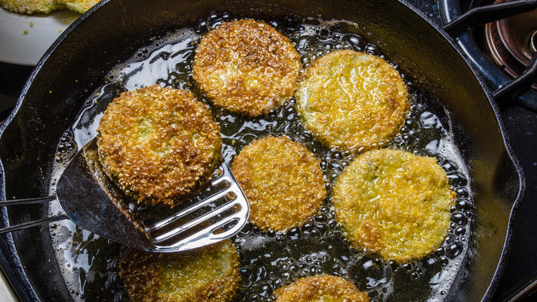 Fried green tomatoes in pan