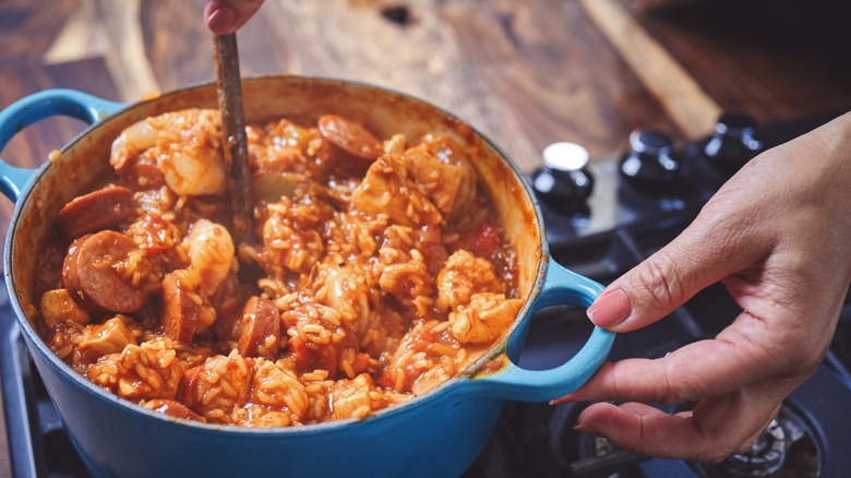 Person cooking Cajun Jambalaya