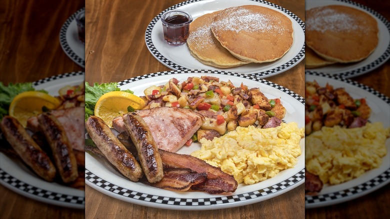 Diner breakfast with pancakes, eggs, breakfast meats and potatoes