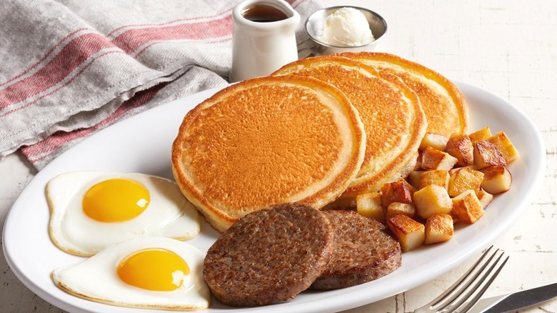 Farmer pancake breakfast with eggs, potatoes, and sausage