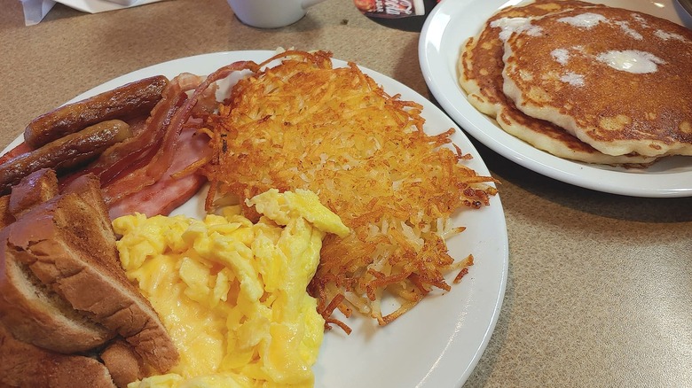Denny's diner breakfast plate on table