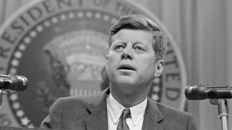 JFK at a podium