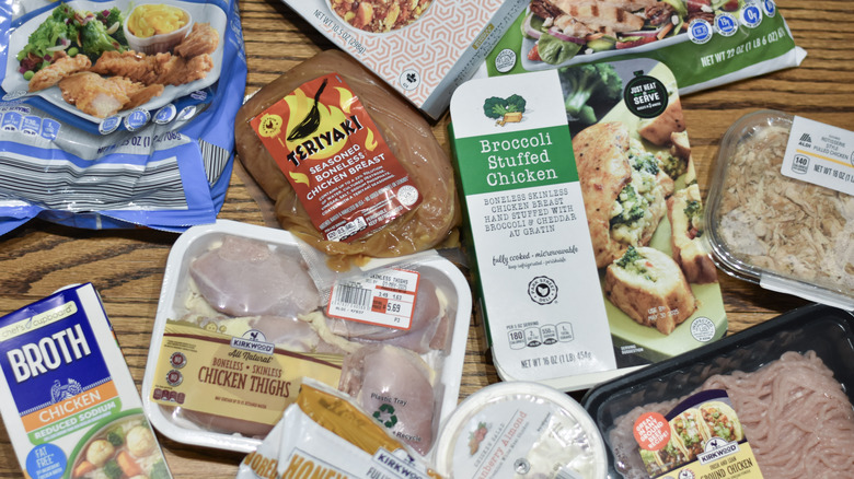 A selection of Aldi chicken products on a wooden table