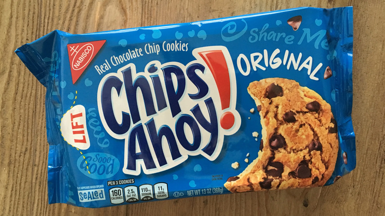 A container of Chips Ahoy! cookies against a wooden background