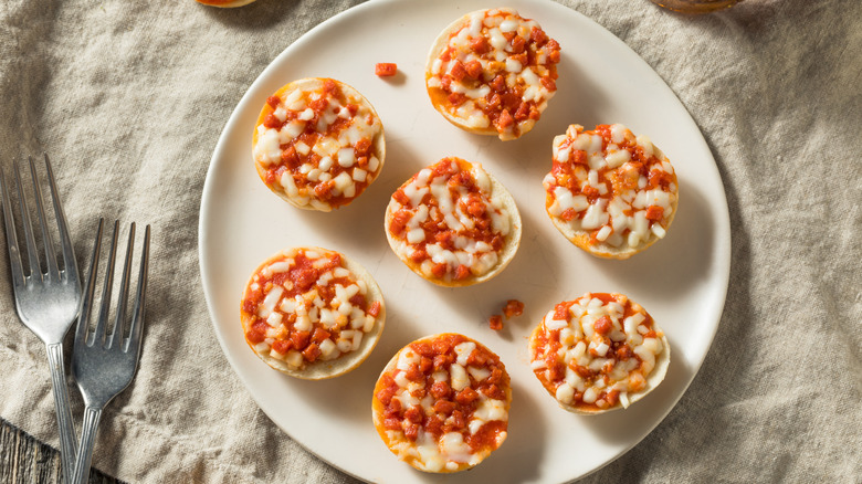 A plate of bite-sized bagel pizzas