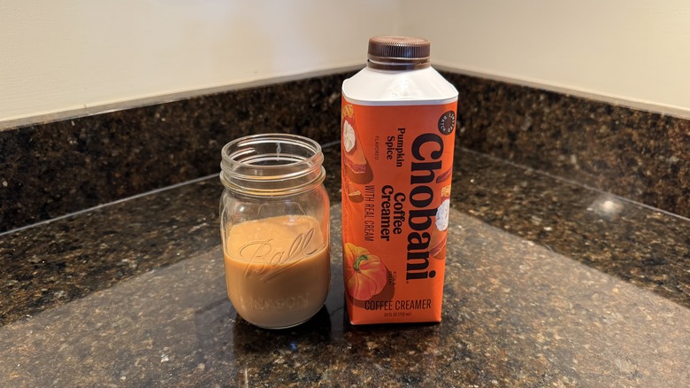 Pumpkin spice coffee creamer on kitchen counter