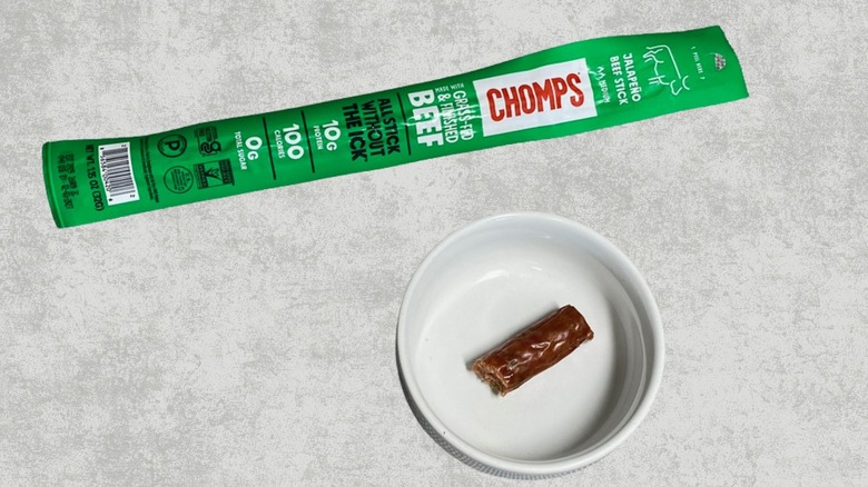A Chomps Jalapeno Beef Stick next to a sample