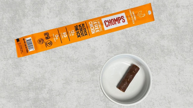Chomps Original Chicken stick next to a sample on a table