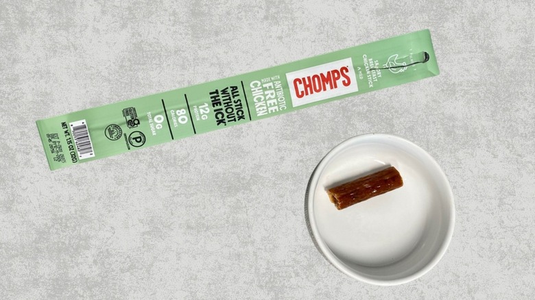 A Chomps savory breakfast chicken stick next to a sample