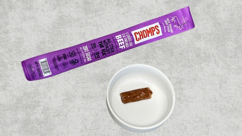 A Chomps Taco Seasoned Beef Stick next to a sample