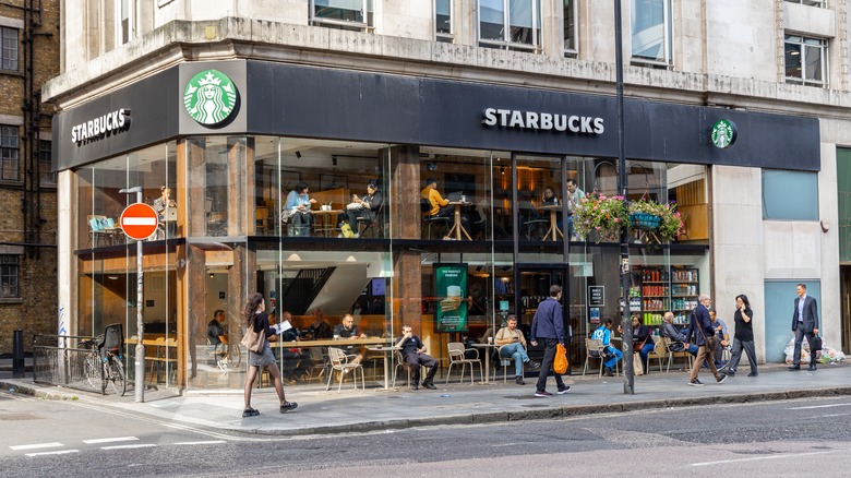 A corner storefront for a city Starbucks