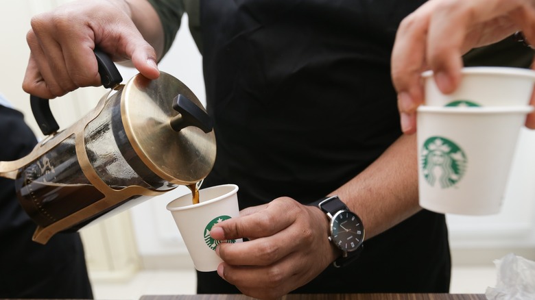 Starbucks worker in a black apron