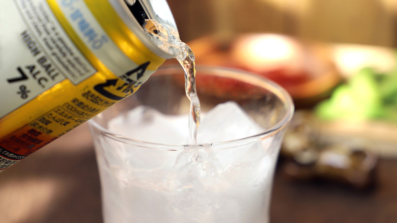Pouring soda into a glass