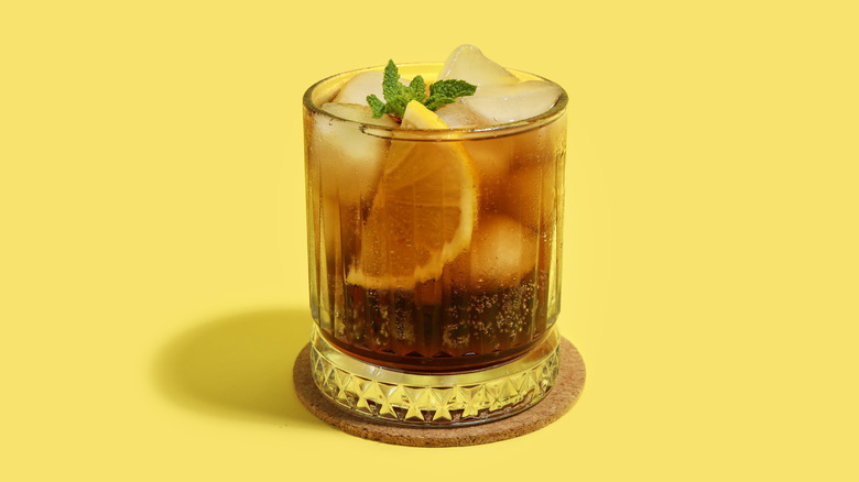 Long Island Iced Tea on a yellow surface