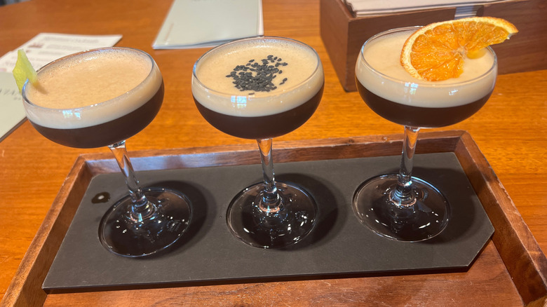 Espresso martini flight on a tray at a bar