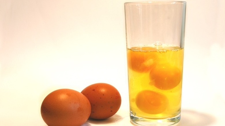 A glass full of raw eggs.