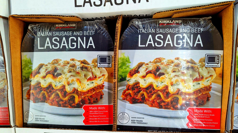 Boxes of Kirkland Signature Italian Sausage and Beef Lasagna at a Costco warehouse