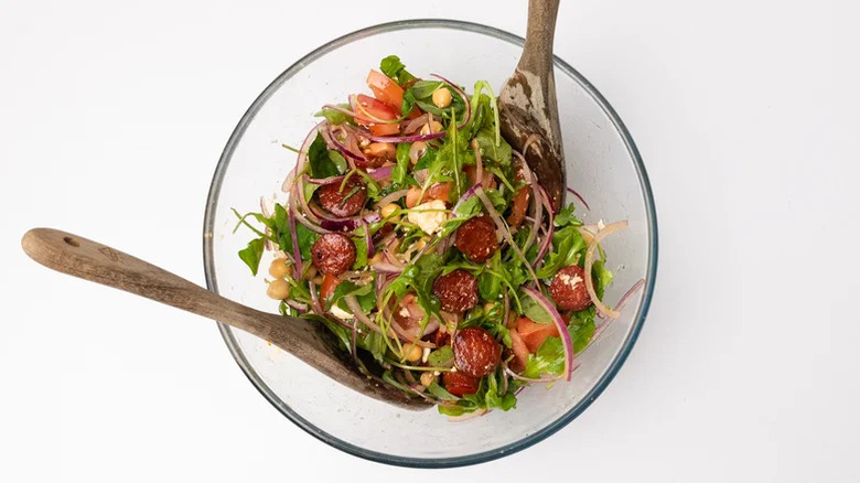 Glass bowl filled with Chorizo Chickpea Salad With Feta