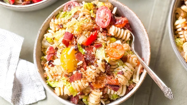 Rustic bowl filled with Over-The-Top BLT Pasta Salad