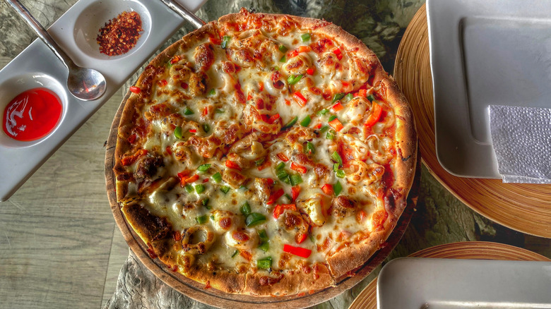 A lobster pizza on a table