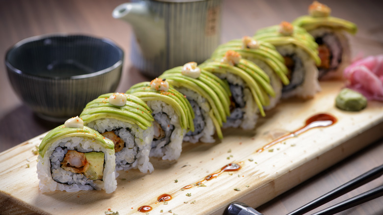 Pieces of sushi on a wooden board