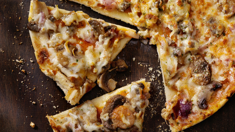 Pizza with homemade crust, meat, and veggies