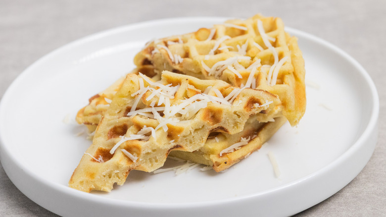 Savory waffles topped with grated cheese