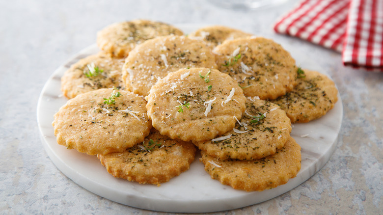 Savory cookies with creamy and herb topping