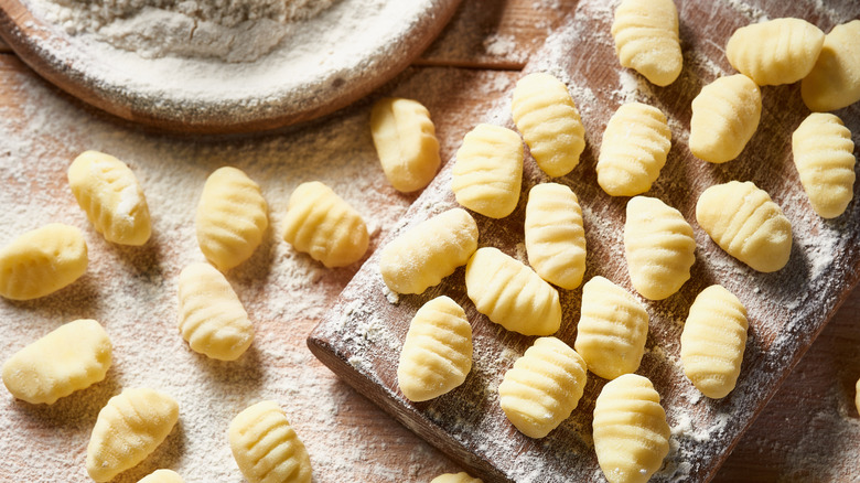 Gnocchi on a board with flour