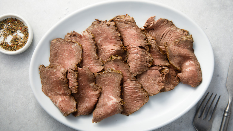 Sliced of roast beef on a white plate